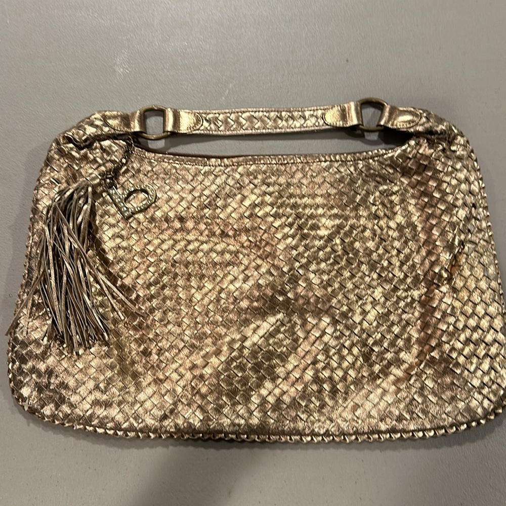 Bebe copper colored leather purse.